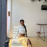 Iconic And Fashionable Young African Female Artistes Now- Ayra Starr in white cropped top and yellow skirt