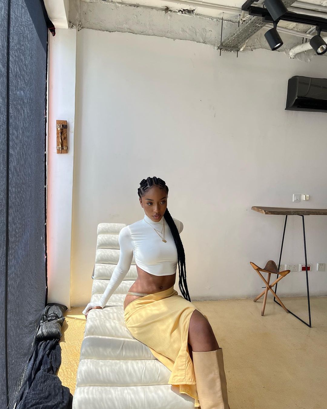 Iconic And Fashionable Young African Female Artistes Now- Ayra Starr in white cropped top and yellow skirt