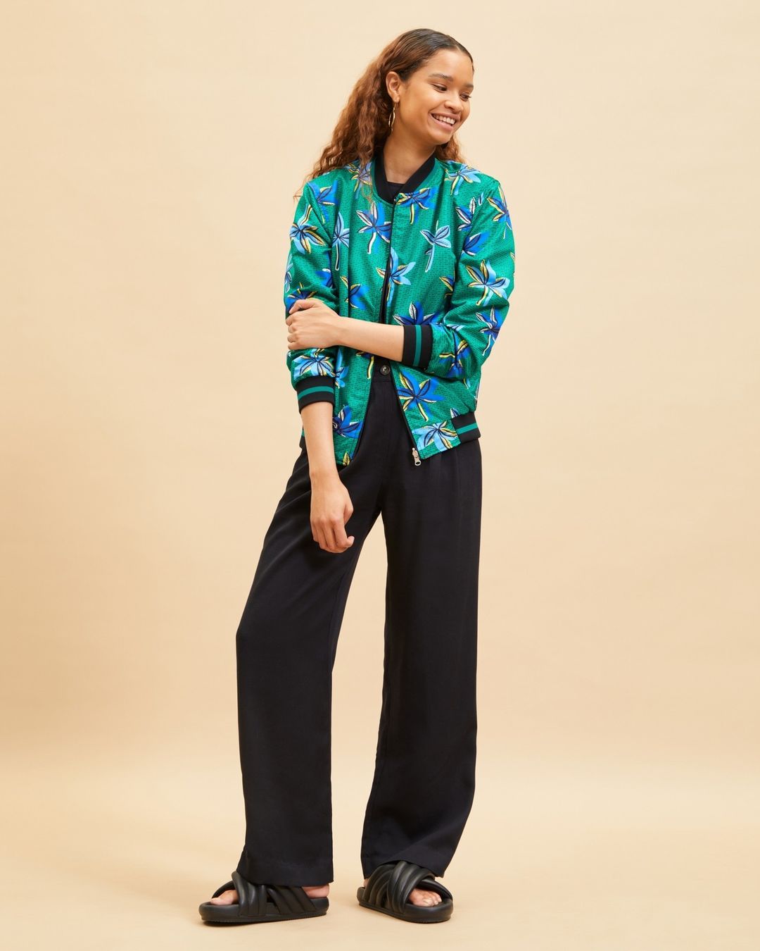 Loungewear in Africa - Mille Collines - a green jacket and black pants